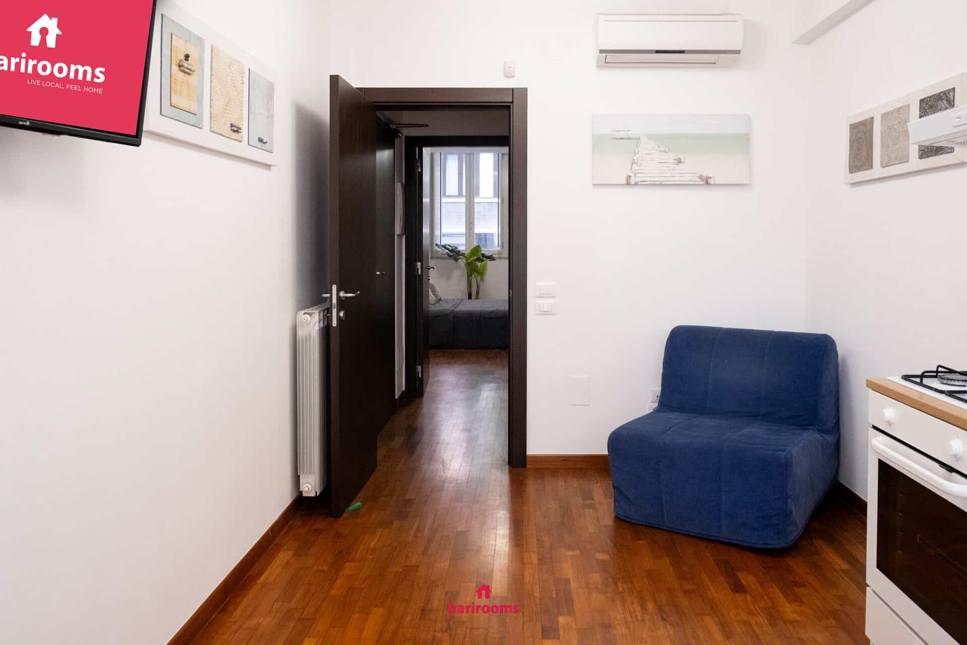 Soggiorno con poltrona letto, appartamento Maison 30 in via Celentano Bari